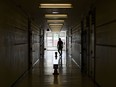 A person walks in the hall at a school in Scarborough, Ont., on Monday, September 14, 2020.