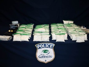 Gatineau police on Wednesday distributed this image of drugs and other items seized during raids of a Pointe-Gatineau apartment and a Cantley storage unit in October.
