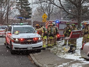 Firefighters at the scene of a fire on Gladstone Ave., Saturday.