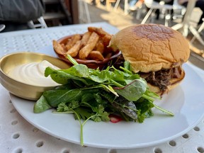 Brisket sandwich with fries and salad at Parlour on Wellington Street West
