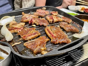 Ribs on a table grill at Korean House in Ottawa's Chinatown.
