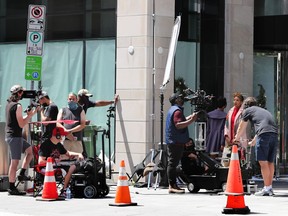 Eva Marcille on set while fimling “A Christmas Fumble” on Queen Street in early July. Tony Caldwell/Postmedia
