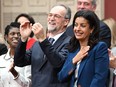 Quebec Liberal Leader Dominique Anglade puts her hand to her heart as she enters with her elected caucus to be sworn in during a ceremony at the legislature in Quebec City, Tuesday, Oct. 18, 2022.