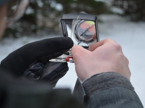 Though they use GPS equipment, a tried and true compass is still useful. Blair Crawford/Postmedia