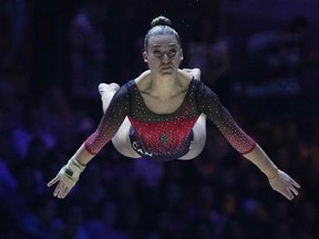 Canada's Laurie Denommee competes on the floor exercise at the Women's Team Final during the Artistic Gymnastics World Championships at M&S Bank Arena in Liverpool, England, Tuesday, Nov. 1, 2022. Denommee, Ellie Black, Denelle Pedrick, Emma Spence and Sydney Turner won bronze in the team event to secure a berth at the 2024 Paris Olympics. It's Canada's first ever world medal in the team event.