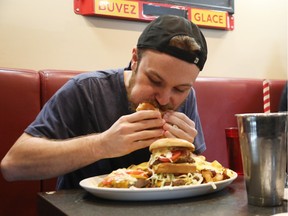 Competitive eater Darrien Thomas conquered the Wellington Diner's Mac Daddy Burger Challenge this week.