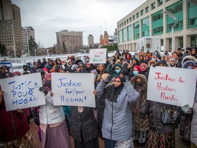 A large group of people came together outside Ottawa City Hall on Saturday afternoon for a vigil in memory of Hodan Hashi, 23, who was killed in Saskatoon, Sask., on Nov. 5.