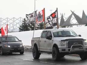 Feb. 10, 2022 : A convoy of trucks circles at the Ottawa International Airport as part of the protest that took over the downtown for three weeks. Did the federal government need the Emergencies Act to deal with the truckers?