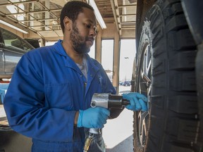 Jason Lespoir installs winter tires at Gordon's Tires in 2016.