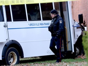 A Brockville police officer works at the scene of a para transit bus collision on Friday afternoon. (RONALD ZAJAC/The Recorder and Times)