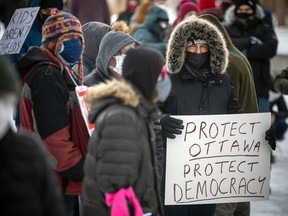 Ottawa-area residents who against the truck convoy protest gathered in Lansdowne Park last winter, then marched through the Glebe.