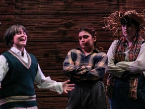 Ara Daigle plays Vern Yellowlees (L), Kealey Lahey plays Flossie (M), and Jaden Croucher plays Russell Yellowlees (R) at St Paul High School’s Cappies production of the Schoolhouse on December 9, 2022.