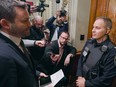 The PQ's Paul St-Pierre Plamondon (left) is denied entry to Quebec's National Assembly after refusing to swear an oath to King on Dec. 1.