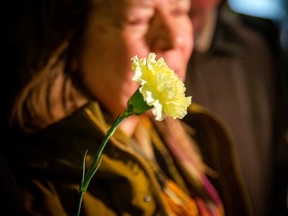 Elisabeth Salm's family members were all holding yellow carnations outside the courthouse Sunday evening.