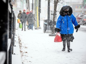 People were out in the Glebe as Ottawa received a heavy snowfall Sunday, December 11, 2022.