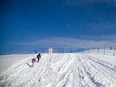 People were sledding outside the erected fence on the Mooney's Bay hill, Sunday, Dec. 18, 2022.