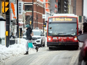 Pedestrians remained cautious as flurries hit the downtown area Saturday, Dec. 24, 2022.