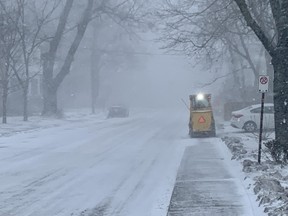 A sidewalk plow heads along Johnson Street Friday afternoon after the winter storm touched down in Kingston and much of the province. Peter Hendra/The Kingston Whig-Standard