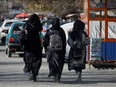 Afghan female students walk near Kabul University in Kabul, Afghanistan, Dec. 21, 2022.