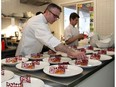 Marc Lepine, award-winning chef and owner of Atelier, is seen plating one of the courses served to dinner guests at a fundraiser at his restaurant in 2016 to raise money for the Thirteen Strings Chamber Orchestra.