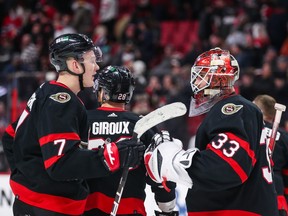 Brady Tkachuk (left) of the Ottawa Senators celebrates with Cam Talbot after a 3-2 win against the Montreal Canadiens at Canadian Tire Centre on Dec. 14, 2022.