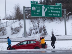 Occupants of a car that slid into the median on Highway 416 northbound near Highway 417.