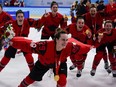 Canada's Marie-Philip Poulin (29) celebrates with her gold medal after the women's gold medal hockey game at the 2022 Winter Olympics, Thursday, Feb. 17, 2022, in Beijing.Poulin has won the 2023 Northern Star Award, making her the first female hockey player to claim the honour given annually to Canada's athlete of the year.