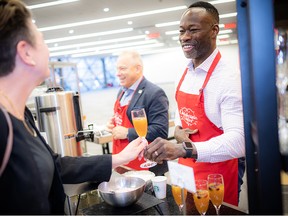Dr. Kwadwo Kyeremanteng, head of the critical care department at The Ottawa Hospital, volunteered his time Friday morning to help serve guests at the Christmas Cheer Breakfast at the Shaw Centre.