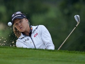 Brooke M. Henderson of Ontario hits out of a green side bunker on the first hole during the final round of the Dana Classic LPGA golf tournament Sunday, Sept. 4, 2022, at the Highland Meadows Golf Club in Sylvania, Ohio.