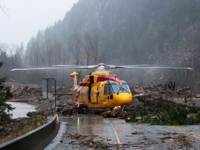 MERRITT, B.C.: A CH-149 Cormorant helicopter is used to help evacuate people from Merritt, B.C., after heavy rain trigged mudslides along a highway in November 2021.
