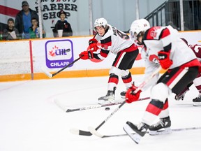 Chris Barlas of the Ottawa 67’s (above) sends a back-hand pass to teammate Vinzenz Rohrer during yesterday’s OHL game at TD Place.