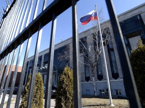The flag flies outside the embassy of the Russian Federation to Canada in Ottawa on Monday, March 26, 2018. Russia's ambassador to Canada, Oleg Stepanov, says Ottawa is at the vanguard of a social-media effort that it argues is meant to demoralize Russian soldiers.