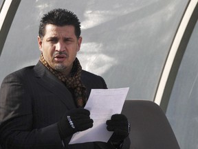 FILE - Former Iran's national soccer team coach Ali Daei before an Asian Cup 2011 qualifying soccer match between Iran and Singapore in Tehran, Iran, Jan, 14, 2009. Daei has expressed support for anti-government protests, saying that his wife and daughter were prevented from leaving the country on Monday, Dec. 26, 2022, after their plane made an unannounced stopover en route to Dubai.