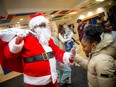 Santa arrived with a bag full of toys and other items for the the third Holiday Gifts of Hope event at the Rideau Community Hub on Saturday.