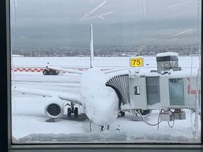 Scenes from YVR on Dec. 20, 2022, after an overnight winter storm blanketed the region with snow.