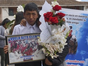 Relatives grieve during the funeral procession of Clemer Rojas, 23, who was killed during protests against new President Dina Boluarte, in Ayacucho, Peru, Saturday, Dec. 17, 2022. The eight deaths this week that converted Ayacucho into the epicenter of violence in Peru's still unfolding crisis is for many a stark reminder of the region's bloody past and longstanding neglect by authorities in the far-away capital.