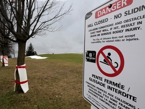 A photo taken in late November shows Mooney's Bay Park, including a "no sledding" sign posted by the City of Ottawa.
