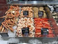 Fresh seafood is shown for sale at a grocery store, Wednesday, July 27, 2022, in Surfside, Fla. This year has been full of economic uncertainty for many. High inflation has affected the cost of living, making housing, food and gas more expensive. Now that we're near the end of the year, people may be setting financial goals for 2023. Consider looking at the current state of the economy and using that to shape your goals.