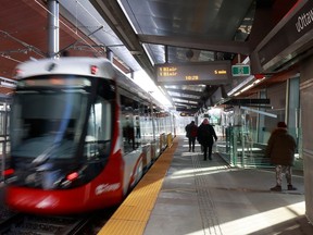 Commuters — fewer than before — take the LRT in Ottawa.