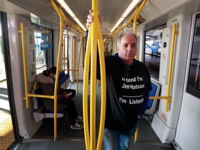 Bruce Deachman rides the Ottawa LRT during the Friday morning rush hour.