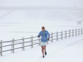OTTAWA - Dec 16, 2022 - Scott Henry does not let the snow get in the way of a good run along side the Rideau Canal in Ottawa Friday. Scott runs up to 30 kms a day and is in training for the Boston Marathon. TONY CALDWELL, Postmedia.