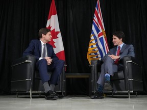 Prime Minister Justin Trudeau, right, meets with B.C. Premier David Eby before an announcement at the Richmond Jewish Day School, in Richmond, B.C., on Friday, December 2, 2022.