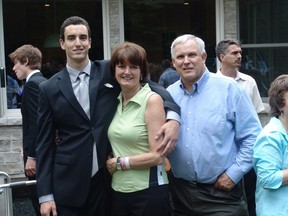 Michael Thomas with his parents, Judy and David, at his high school graduation. Photos courtesy of the Thomas family