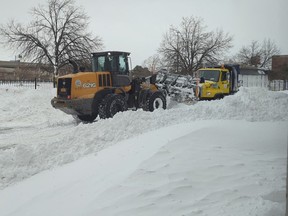 Ploughs get stuck during snow in downtown Buffalo, New York, U.S. December 25, 2022.