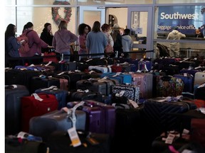 Southwest Airlines passengers wait in line at the baggage services office after U.S. airlines, led by Southwest, canceled thousands of flights due to a massive winter storm which swept over much of the country before and during the Christmas holiday weekend, at Dallas Love Field Airport in Dallas, Texas, U.S., December 28, 2022.