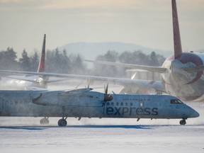 An Air Canada aircraft taxis at Vancouver International Airport in Richmond, B.C., on Wednesday, Dec. 21, 2022. A major winter storm is bearing down on Ontario and Quebec, with residents being warned to reconsider travel plans as conditions could get hazardous.THE CANADIAN PRESS/Darryl Dyck