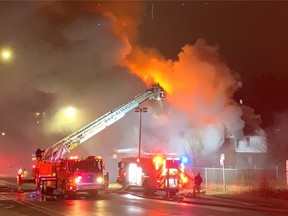 Kingston Fire and Rescue firefighters at the scene of a building fire at Princess Street and Alfred Street in Kingston on Tuesday night.