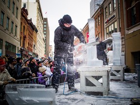 Spectators watch an ice carving artist at work on Sparks Street on Feb. 15, 2020, during the last in-person Winterlude festival.