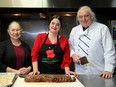 Alta Vista Coun. Marty Carr (centre) helps out in the kitchen with President and Founder of Food for Thought Ottawa Sylvain de Margerie and his wife, Doris de Margerie. 
Food for Thought prepares about 1,500 hot meals a day for those in need.