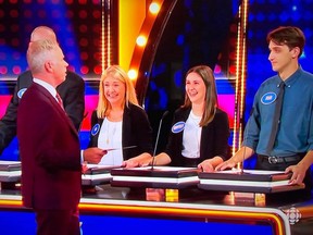 Family Feud Canada host Gerry Dee chatting with members of the Ruffo family team, including Joah Vaillancourt (far right) of Alexandria.